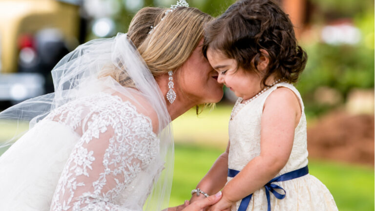 A 3-YEAR-OLD CANCER SURVIVOR SERVED AS A FLOWER GIRL IN HER BONE MARROW DONOR’S WEDDING